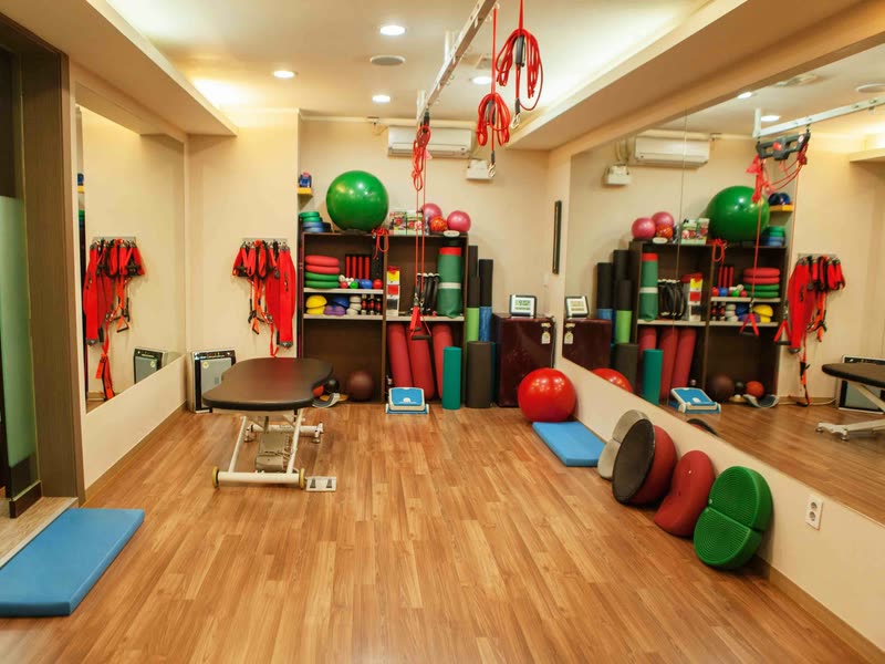 Exercise studio at Create Wellness Center with mats, stability balls, foam rollers and resistance bands